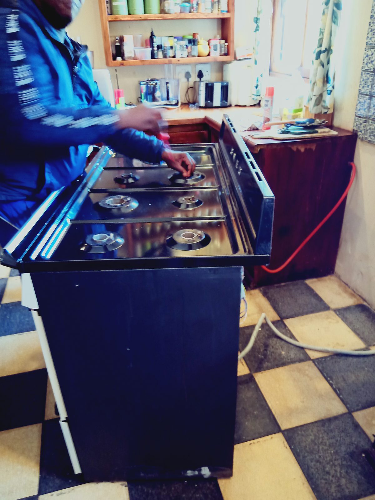 Welkom Appliance Repairs technician repairing a stove in a customer's kitchen